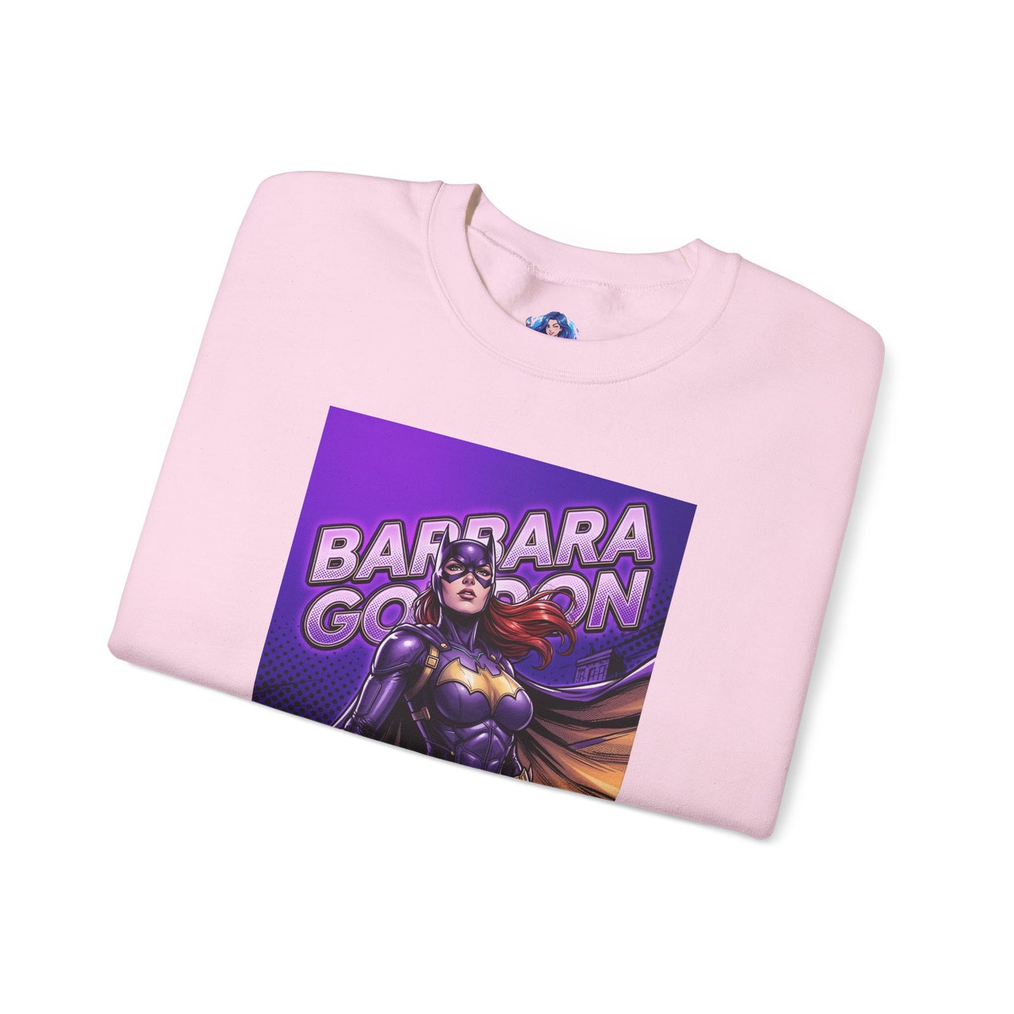 Batgirl Sweatshirt, DC Comics Crewneck, Gotham Hero Fan Apparel showing purple-and-gold Batgirl graphic on folded pink crewneck