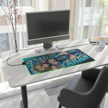 Samus Aran RGB Desk Mat, Sci-Fi Action Gaming Mouse Pad, LED Desk Mat for Gamer Setup on modern desk with blue-toned armored Samus artwork and RGB edge lighting