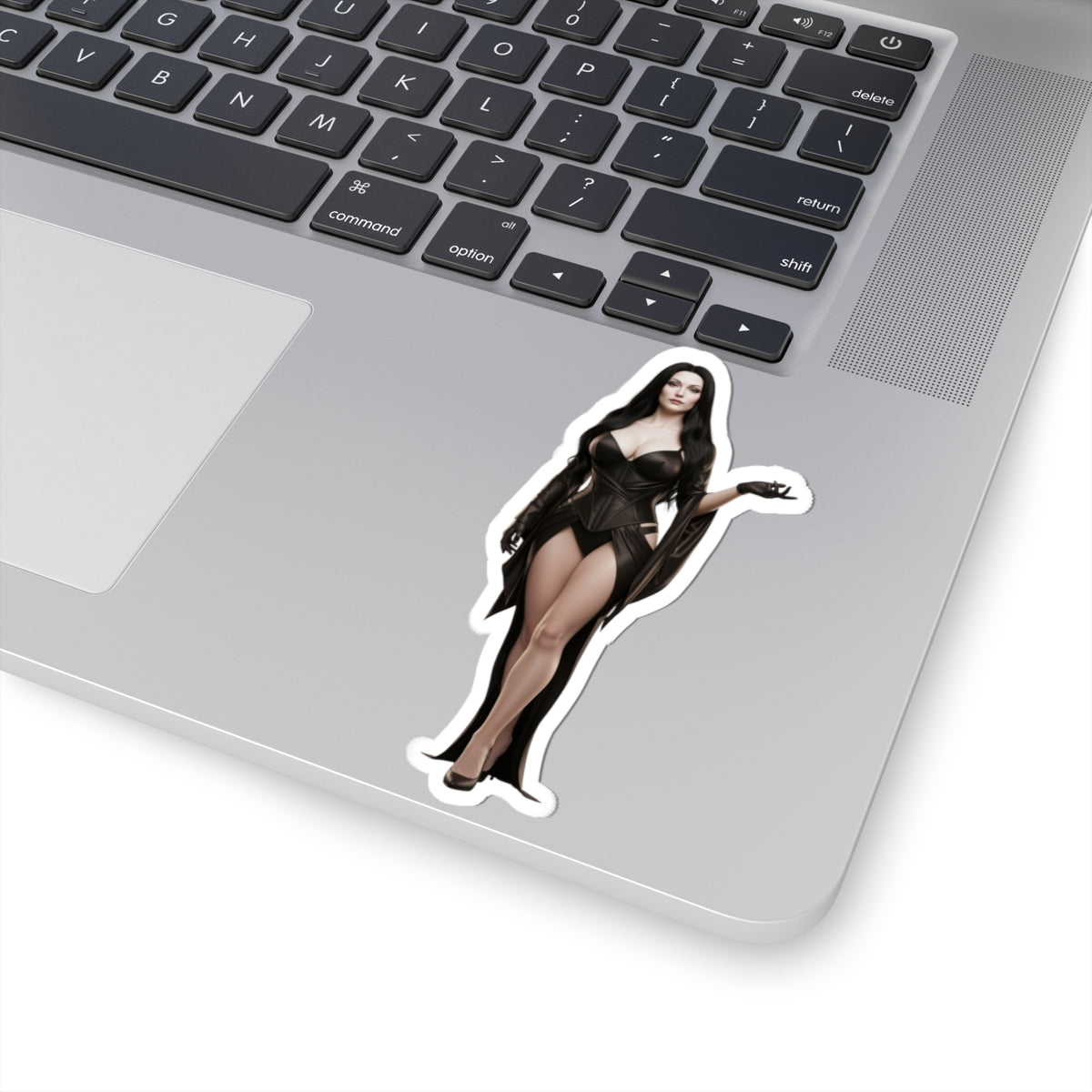 Morticia Addams Sticker – Gothic Character Vinyl Sticker for Laptops & Indoor Decor on silver laptop, glossy durable vinyl, bubble-free application