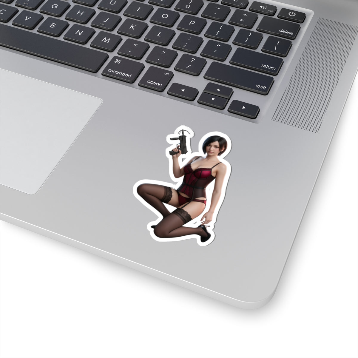 Ada Wong Sticker – Survival Game Vinyl Sticker for Laptops & Indoor Decor on laptop showing glossy, durable vinyl decal of iconic character in red outfit holding handgun
