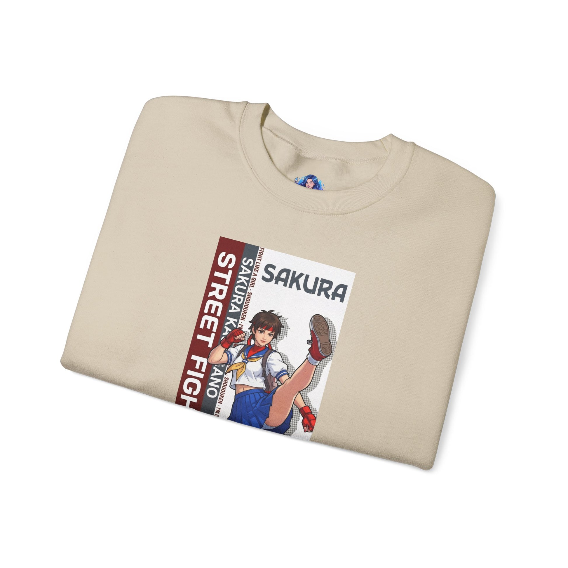Sakura Sweatshirt, Street Fighter Crewneck, Classic Fighting Game Apparel for Fans folded beige crewneck with Sakura character art and red-white design