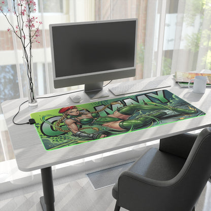 Cammy RGB Desk Mat, Fighting Game Gaming Mouse Pad, LED Desk Mat for Gamer Setup on white desk showing bold green Cammy artwork and RGB lighting