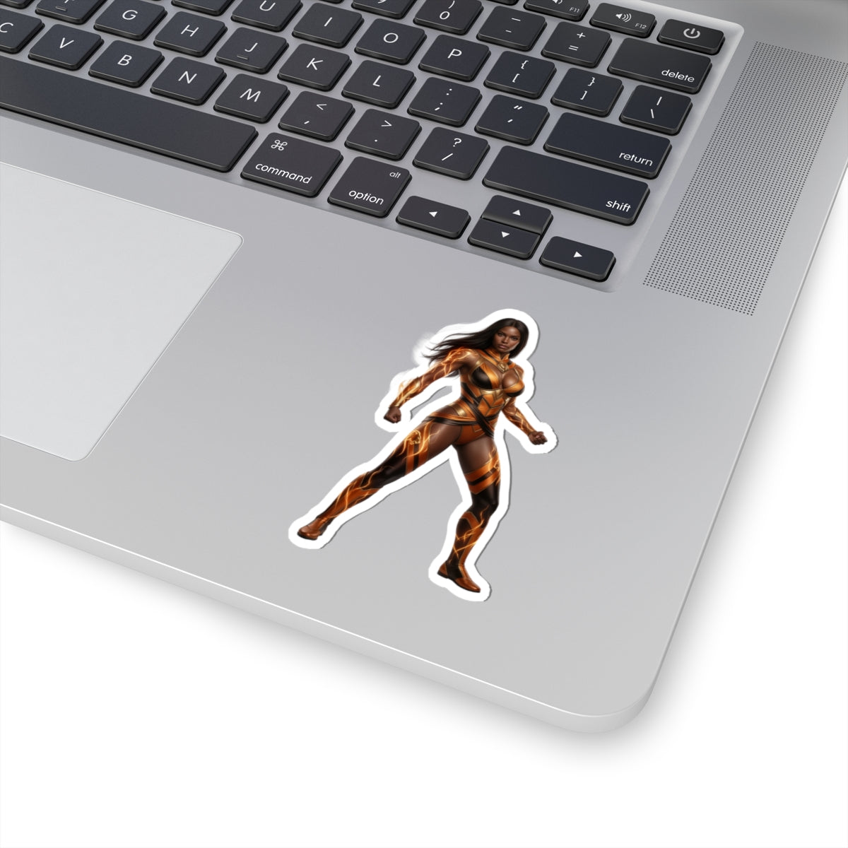 Vixen Sticker – Comic Heroine Vinyl Sticker for Laptops & Indoor Decor on silver laptop showing glossy, vibrant comic heroine vinyl sticker applied