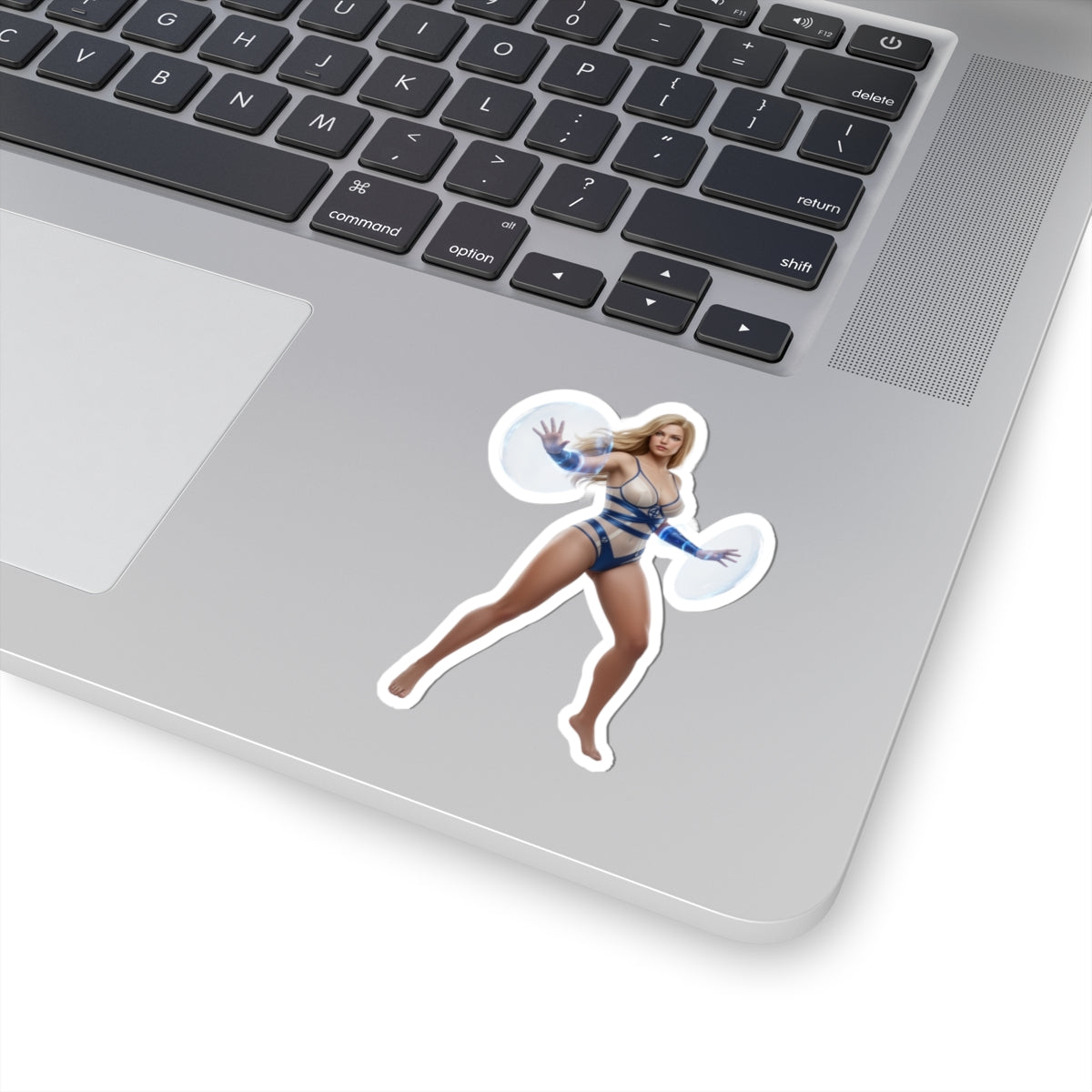 Invisible Woman Sticker – Comic Heroine Vinyl Sticker for Laptops & Indoor Decor on silver laptop showing glossy, vibrant comic-style heroine vinyl sticker
