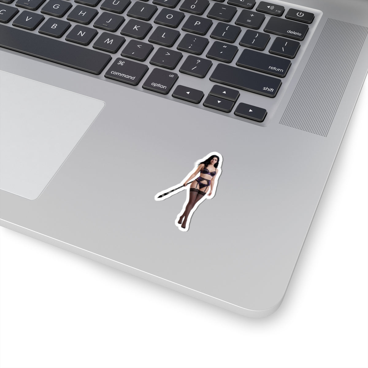 Yennefer Sticker – Fantasy Character Vinyl Sticker for Laptops & Indoor Decor on silver laptop showing dark elegant character vinyl sticker, glossy finish