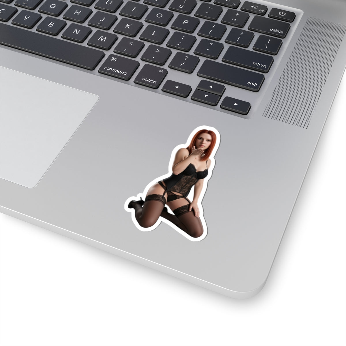 Black Widow Sticker – Comic Heroine Vinyl Sticker for Laptops & Indoor Decor: glossy durable vinyl comic-style heroine decal on silver laptop
