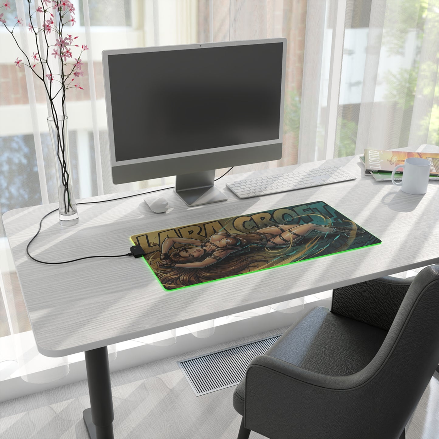Lara Croft RGB Desk Mat, Adventure Game Gaming Mouse Pad, LED Desk Mat for Gamer Setup on a modern white desk with PC monitor and green LED edge