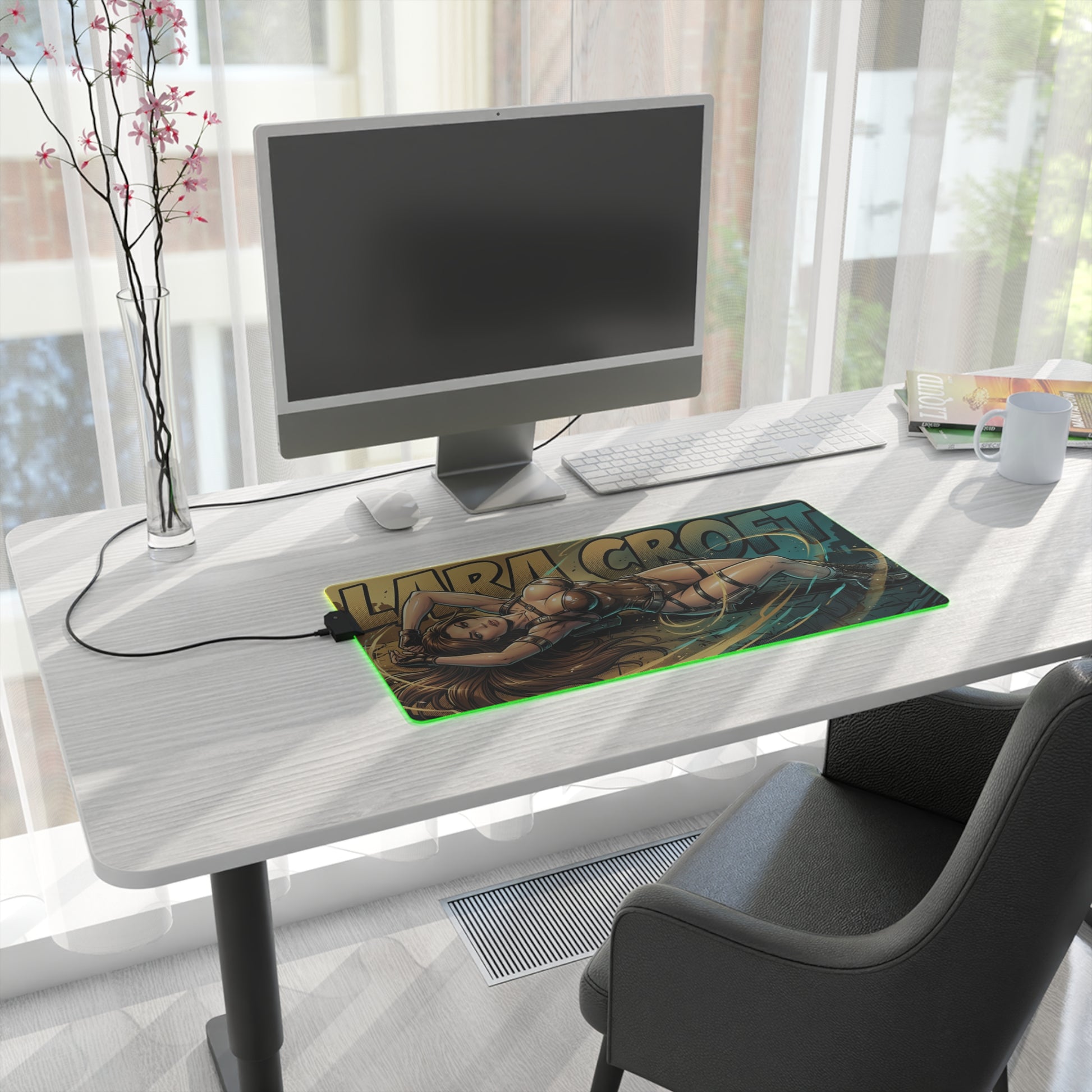 Lara Croft RGB Desk Mat, Adventure Game Gaming Mouse Pad, LED Desk Mat for Gamer Setup on a modern white desk with PC monitor and green LED edge