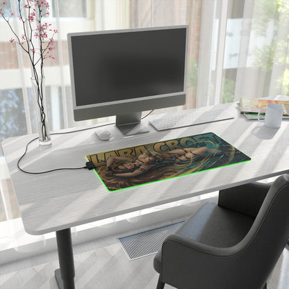 Lara Croft RGB Desk Mat, Adventure Game Gaming Mouse Pad, LED Desk Mat for Gamer Setup on a modern white desk with PC monitor and green LED edge