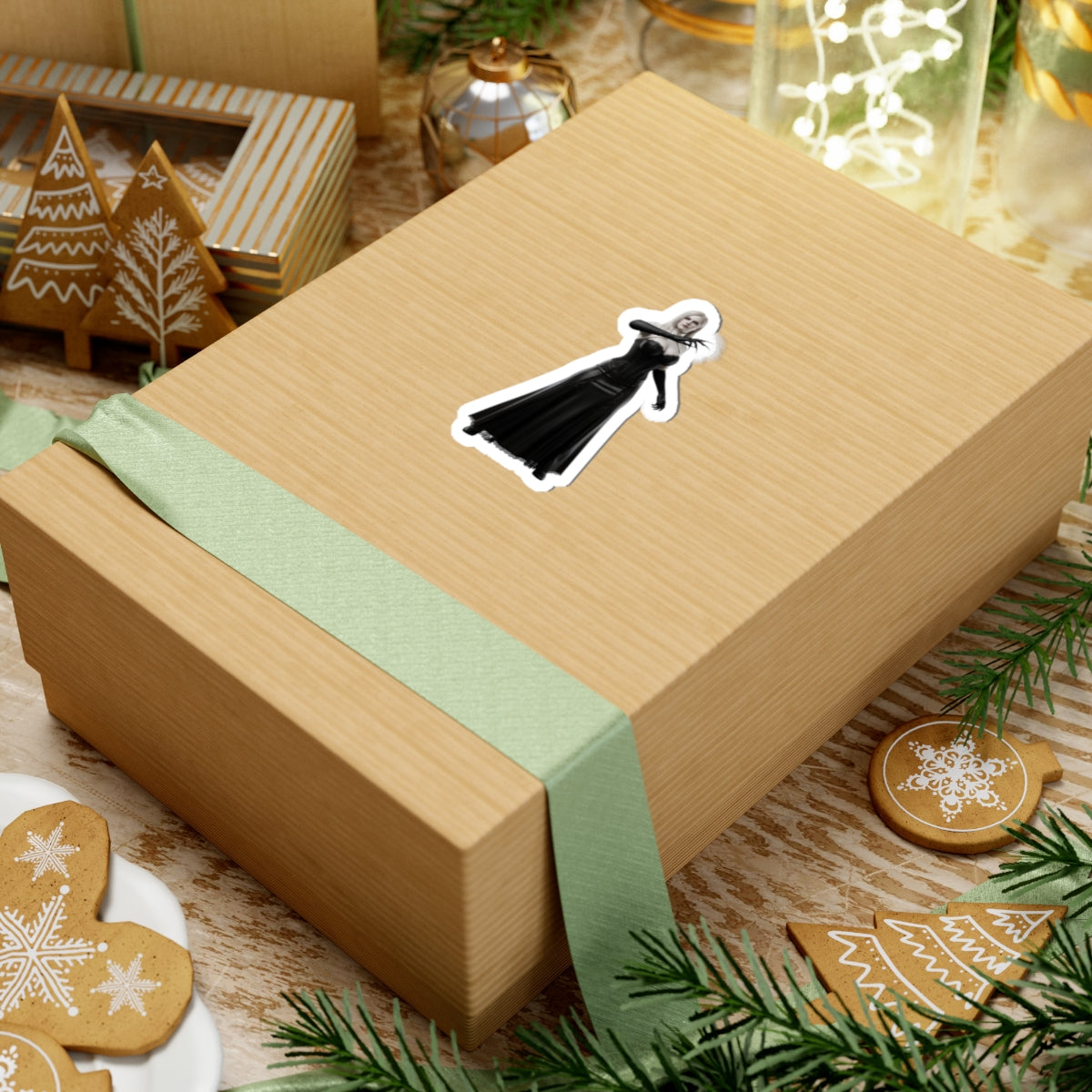Lady Dimitrescu Sticker – Gothic Game Character Vinyl Sticker for Laptops & Decor on a wrapped holiday gift box, glossy black-and-white vinyl decal