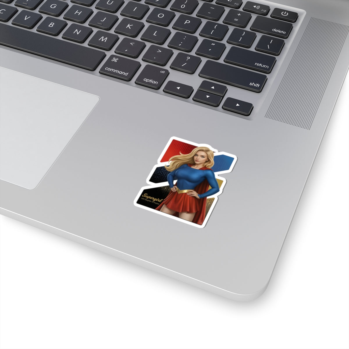 Supergirl Sticker – Superhero Vinyl Sticker for Laptops & Indoor Decor on silver laptop showing glossy, durable vinyl sticker with vibrant colors