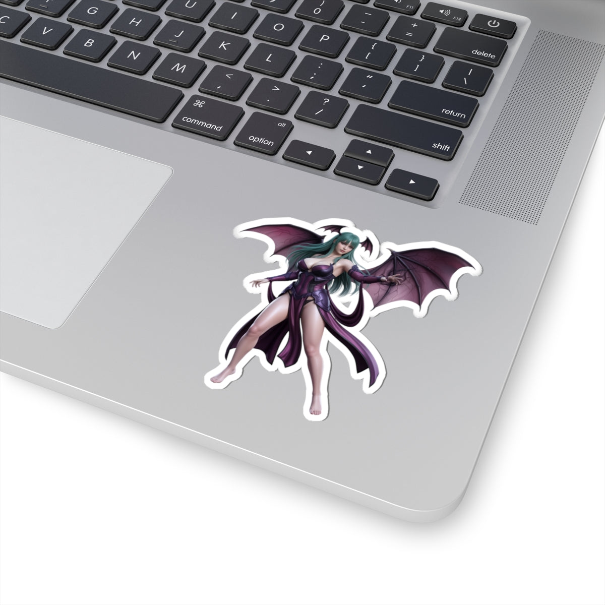 Morrigan Aensland Sticker – Darkstalkers Vinyl Sticker for Laptops & Indoor Decor vinyl sticker on silver laptop showing glossy, detailed Morrigan artwork
