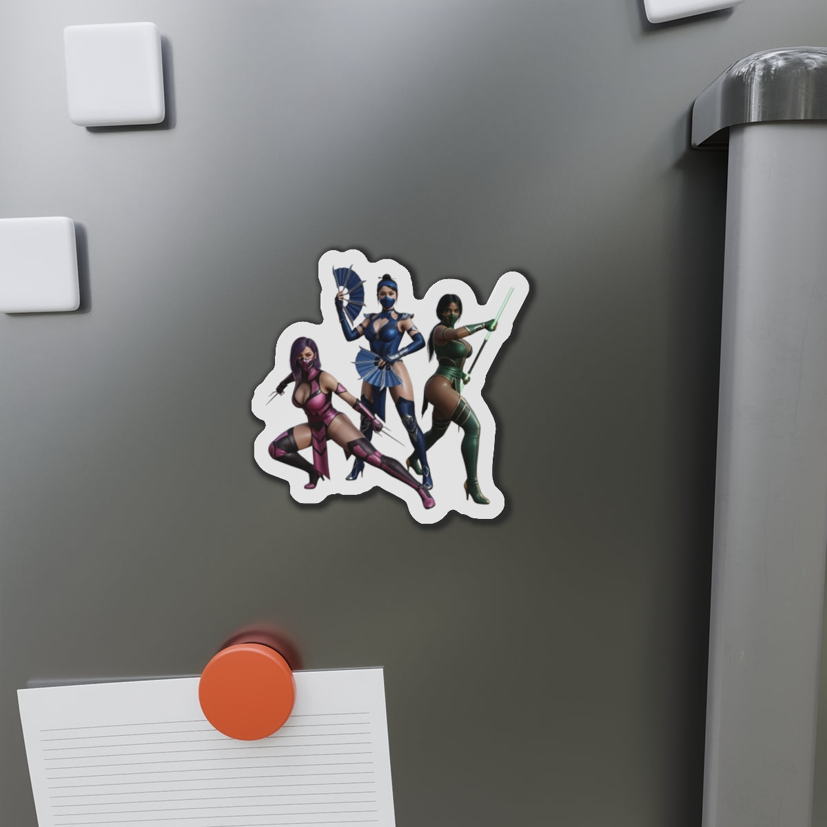 Kitana, Jade, Mileena Magnet – Mortal Kombat Anime Trio Fridge Magnet die-cut vinyl magnet showing anime-style Kitana, Jade and Mileena on a gray fridge