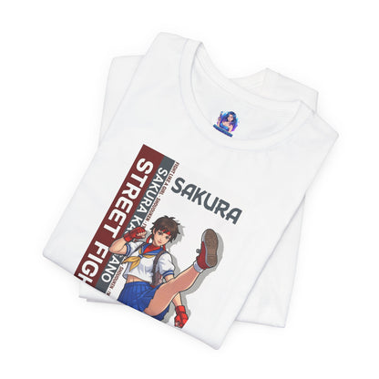 Sakura Kasugano T-Shirt | Street Fighter Anime Tee for Gamers & Fighting Game Fans – white Bella Canvas tee featuring dynamic Sakura school-fighter illustration