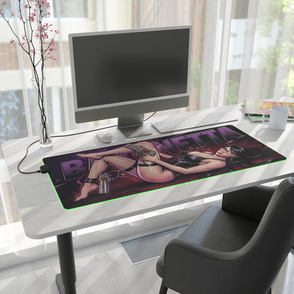 Bayonetta RGB Desk Mat, Action Game Gaming Mouse Pad, LED Desk Mat for Gamer Setup displaying witch heroine artwork on a modern white desk with RGB glow
