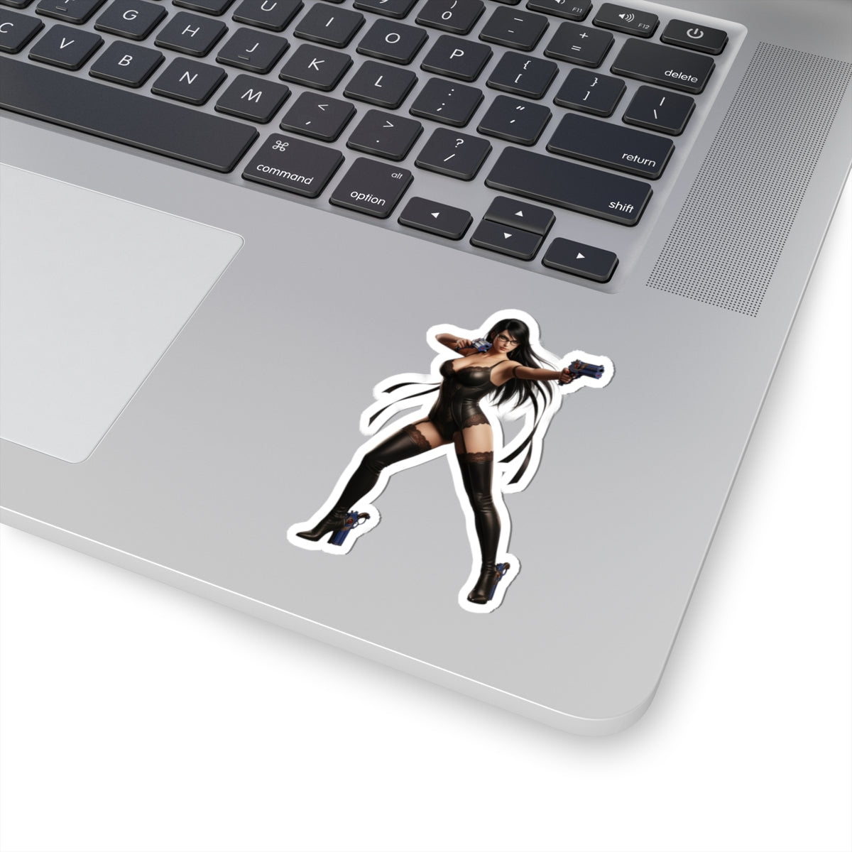 Bayonetta Sticker – Action Game Vinyl Sticker for Laptops & Indoor Decor on silver laptop showing glossy, durable vinyl, bold character artwork