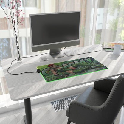 Cammy RGB Desk Mat, Fighting Game Gaming Mouse Pad, LED Desk Mat for Gamer Setup on white modern desk with PC and streaming-ready green military artwork