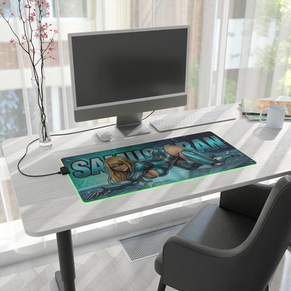Samus Aran RGB Desk Mat, Futuristic Gaming Mouse Pad, LED Desk Mat for Gamer Setup on a modern white desk with glowing green RGB edge and sci-fi armor artwork