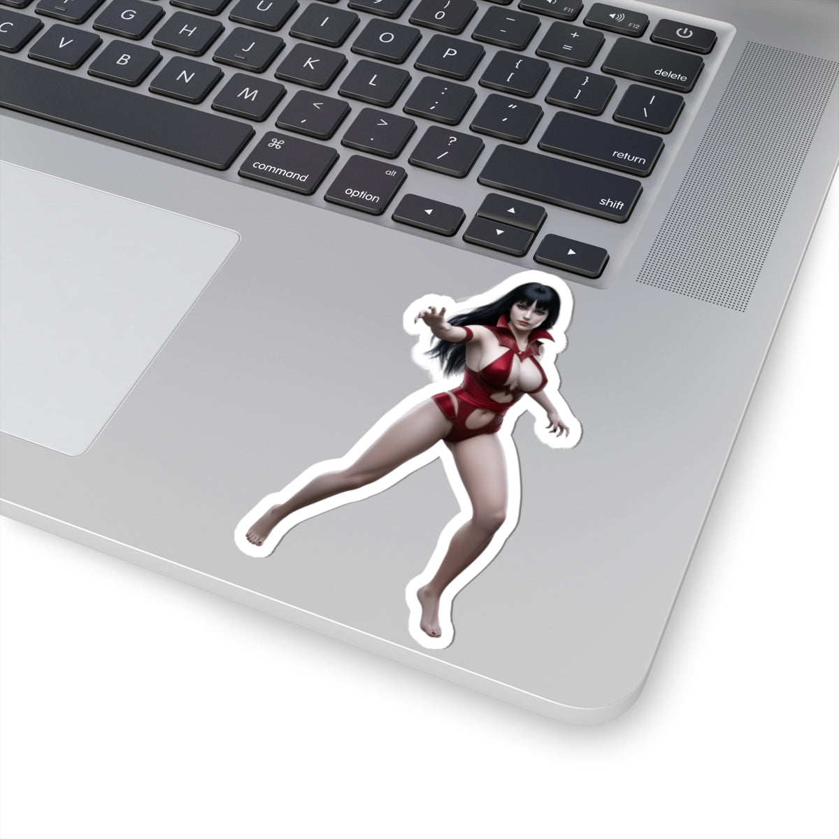 Vampirella Sticker – Gothic Comic Vinyl Sticker for Laptops & Indoor Decor on silver laptop showing glossy die-cut vinyl sticker of Vampirella character