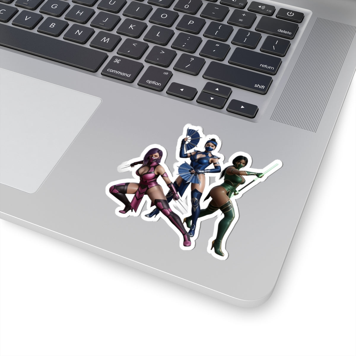 Kitana, Jade, Mileena Sticker – Mortal Kombat Vinyl Sticker for Laptops & Indoor Decor showing three iconic warriors on a laptop