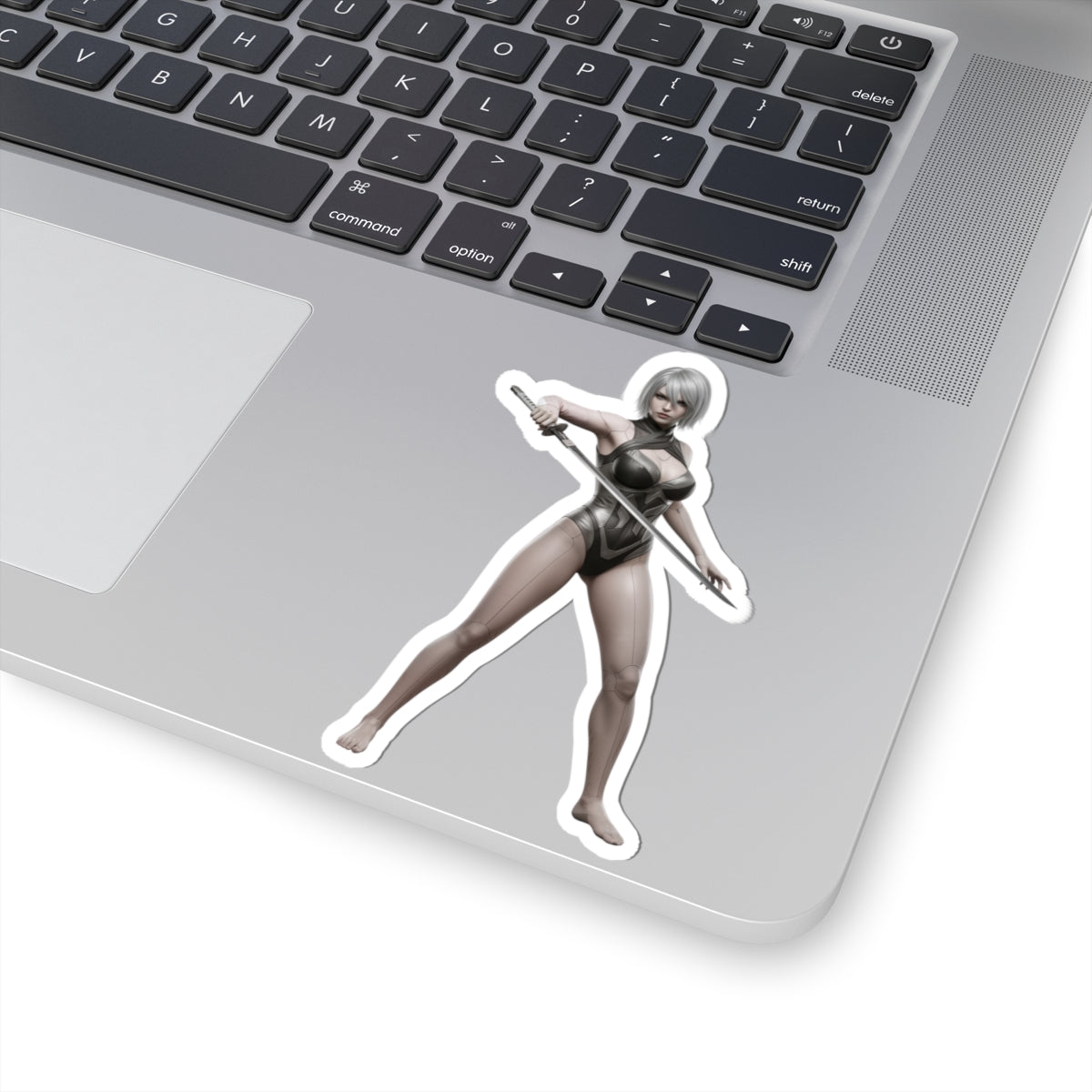 A2 Nier Sticker – Sci-Fi Game Vinyl Sticker for Laptops & Indoor Decor on silver laptop showing glossy durable vinyl character decal