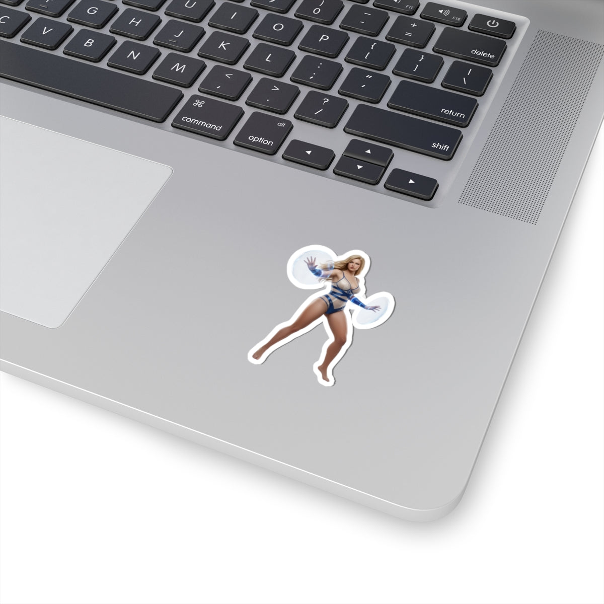 Invisible Woman Sticker – Comic Heroine Vinyl Sticker for Laptops & Indoor Decor on silver laptop showing glossy, durable vinyl, crisp comic-style artwork