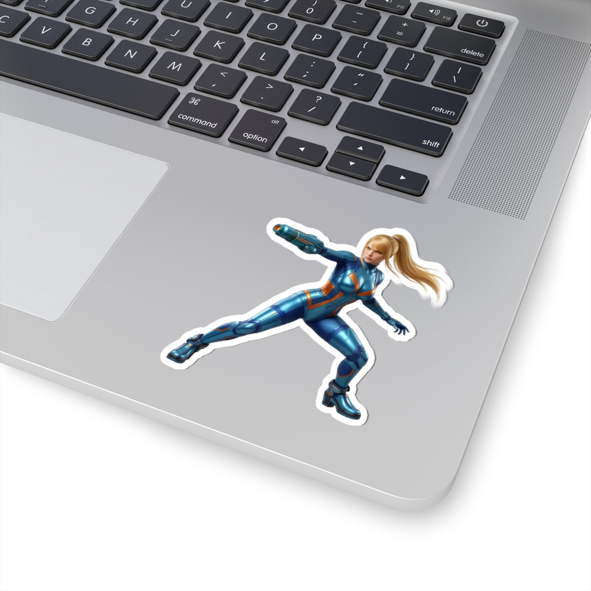 Samus Aran Sticker – Futuristic Game Vinyl Sticker for Laptops & Indoor Decor on silver laptop showcasing glossy, durable vinyl, vibrant colors and bubble-free application