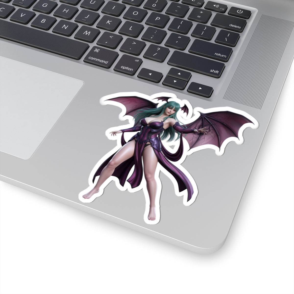 Morrigan Aensland Sticker – Darkstalkers Vinyl Sticker for Laptops & Indoor Decor on silver laptop showing glossy, durable vinyl die-cut sticker