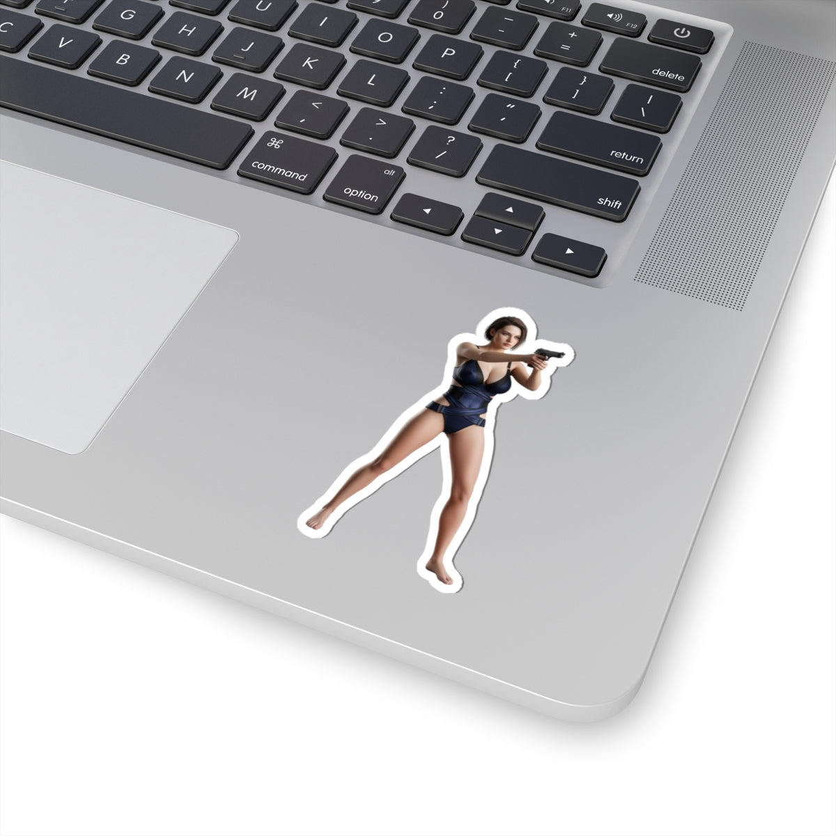 Jill Valentine Sticker – Survival Game Vinyl Sticker for Laptops & Indoor Decor on silver laptop, glossy durable vinyl, tactical character pose