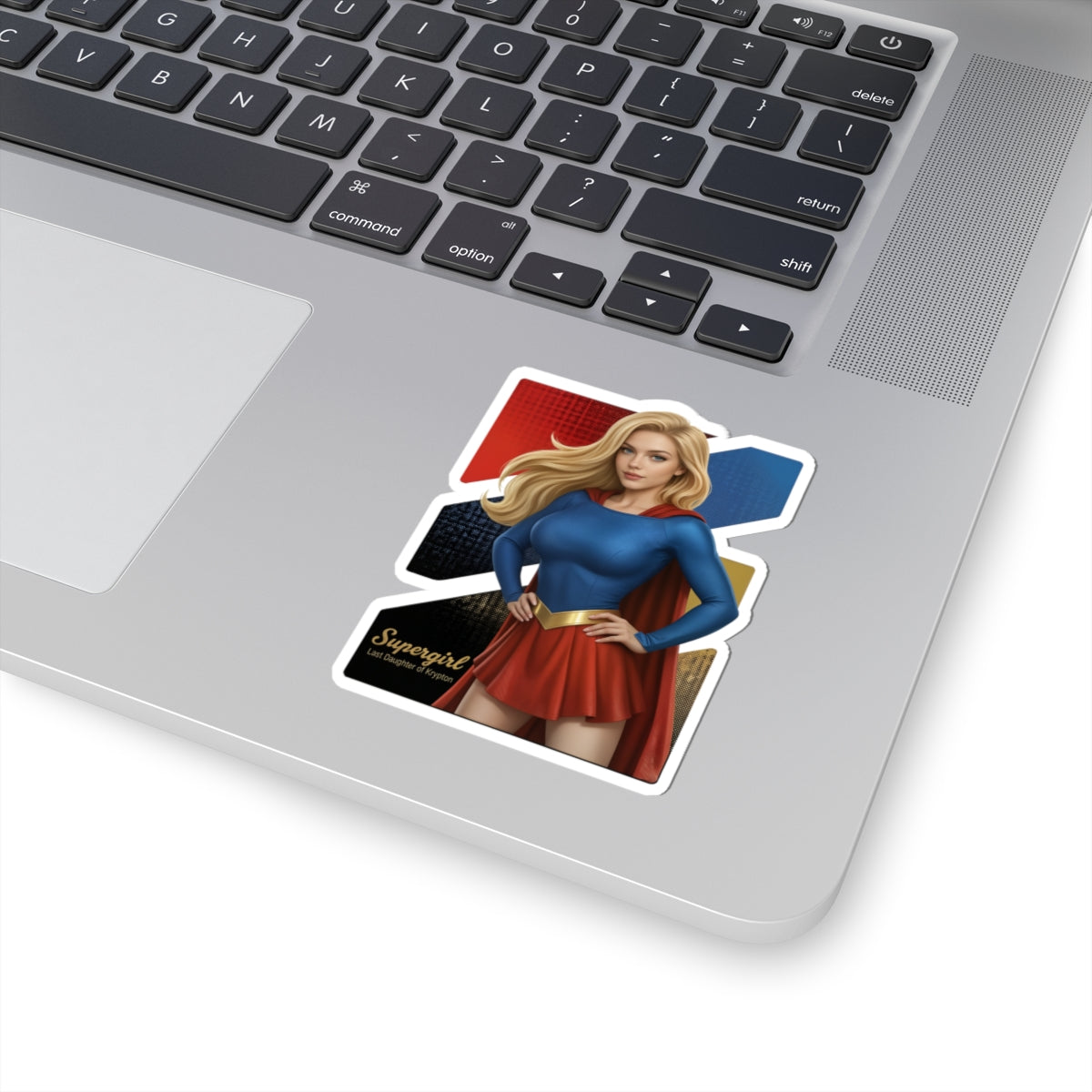 Supergirl Sticker – Superhero Vinyl Sticker for Laptops & Indoor Decor showing vibrant glossy Supergirl vinyl decal on a laptop, durable adhesive and sharp detail
