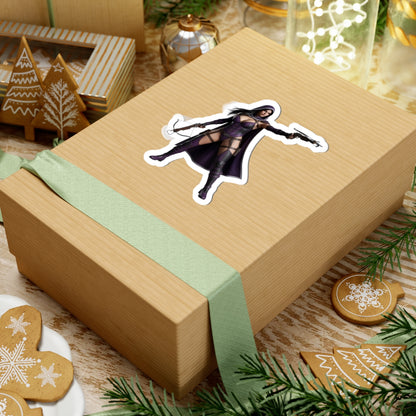 Huntress Sticker – Comic Heroine Vinyl Sticker for Laptops & Indoor Decor on a wrapped gift box, glossy vinyl comic-style heroine sticker applied smoothly