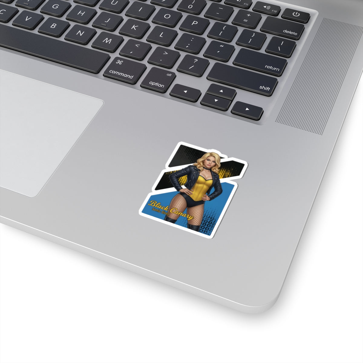 Black Canary Sticker – Comic Heroine Vinyl Sticker for Laptops & Indoor Decor shown on silver laptop corner, glossy vibrant vinyl decal