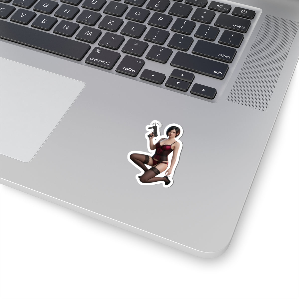 Ada Wong Sticker – Survival Game Vinyl Sticker for Laptops & Indoor Decor showing glossy character decal on a silver laptop corner