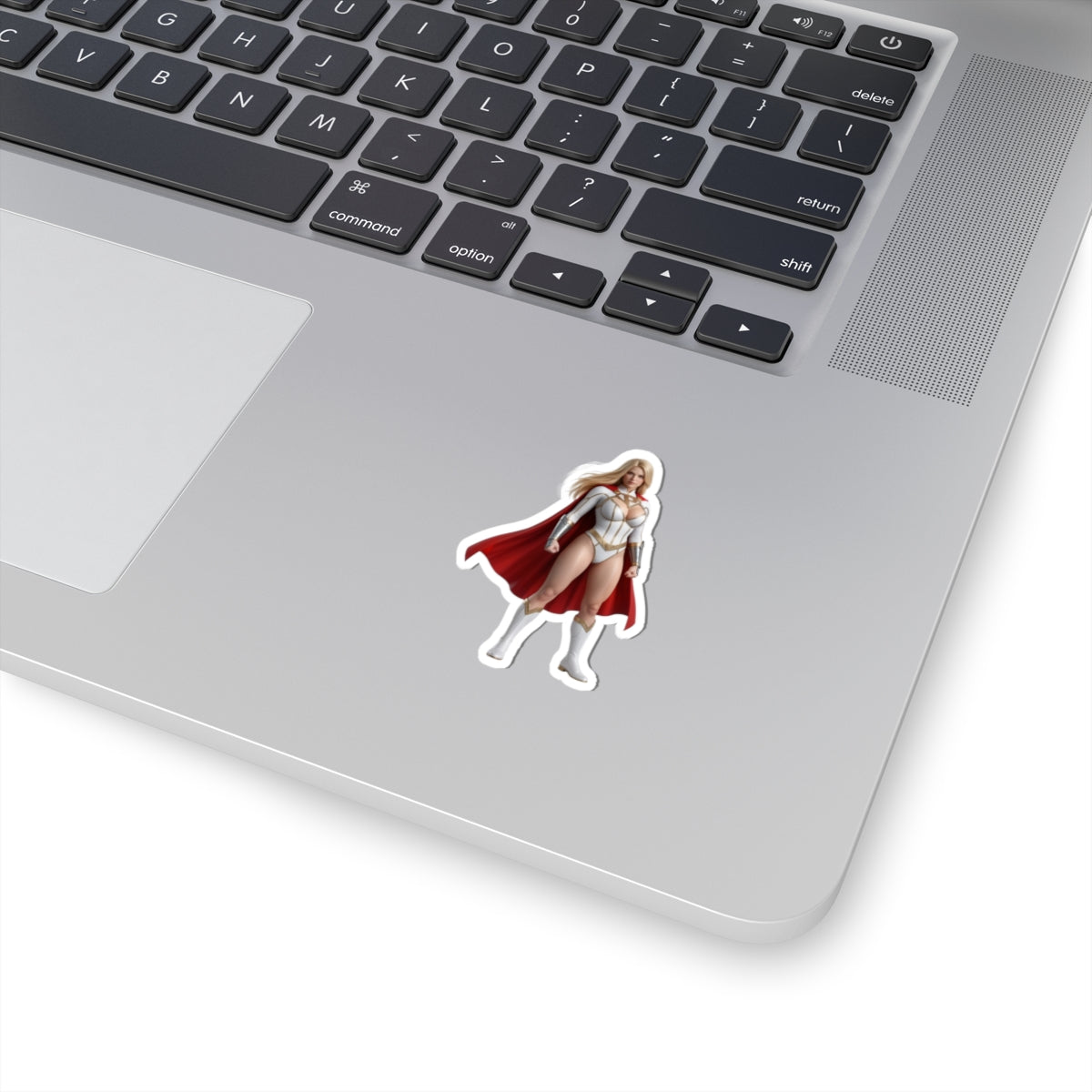 Power Girl Sticker – Comic Heroine Vinyl Sticker for Laptops & Indoor Decor on silver laptop showing glossy, durable vinyl sticker with bold comic-style artwork