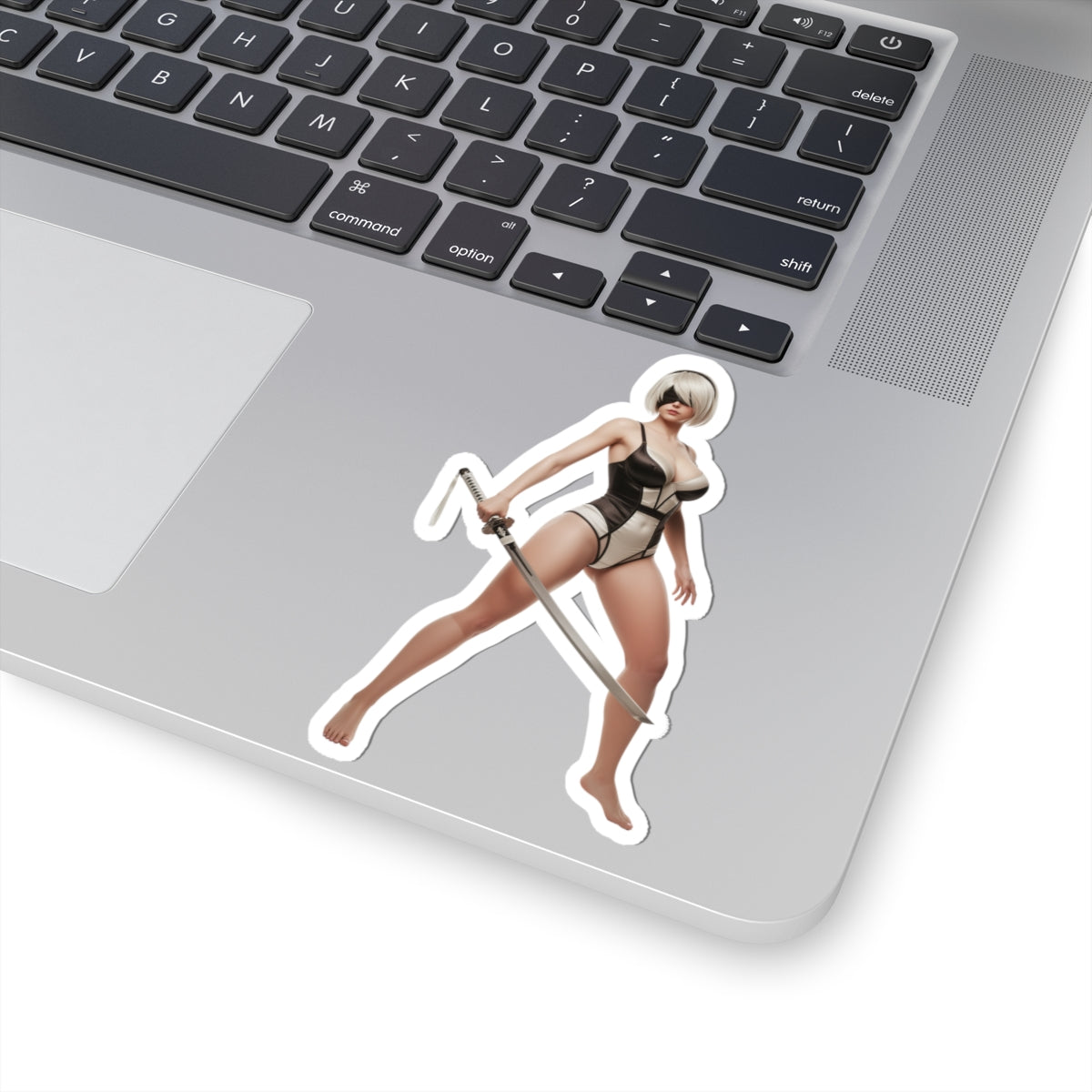 2B Sticker – Sci-Fi Game Vinyl Sticker for Laptops & Indoor Decor on silver laptop, glossy durable vinyl cut‑out of iconic sci‑fi character with sword