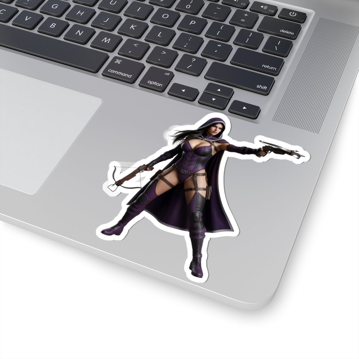 Huntress Sticker – Comic Heroine Vinyl Sticker for Laptops & Indoor Decor on laptop showing glossy, durable vinyl, vibrant comic-style artwork