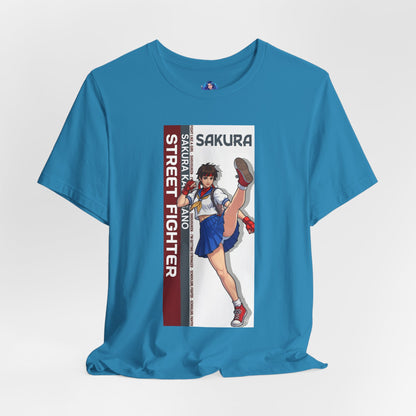 Sakura Kasugano T-Shirt | Street Fighter Anime Tee for Gamers & Fighting Game Fans - blue tee with anime Sakura kick design on Bella Canvas 3001
