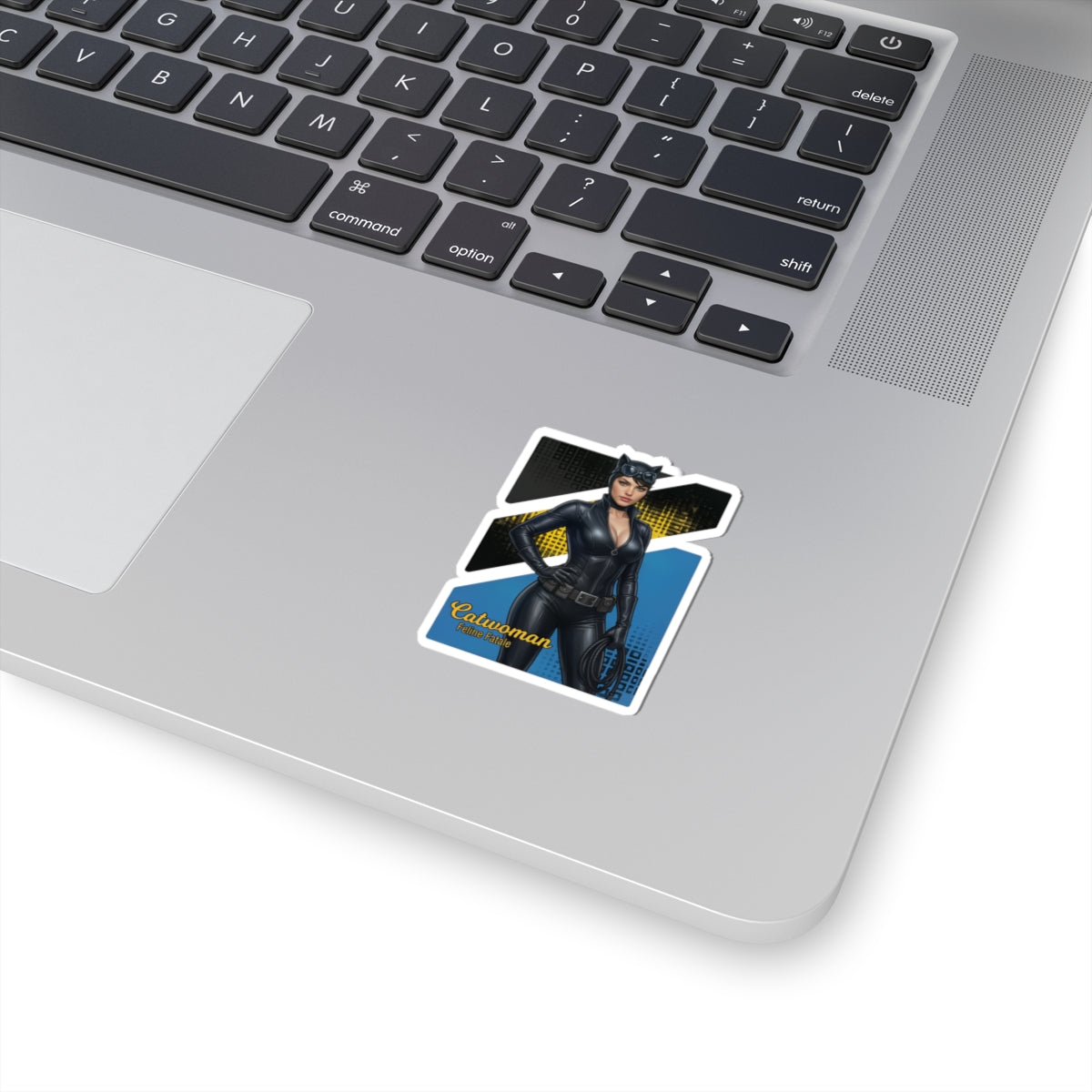 Catwoman Sticker – Comic Heroine Vinyl Sticker for Laptops & Indoor Decor on silver laptop showing glossy, durable vinyl, vibrant comic-style Catwoman design