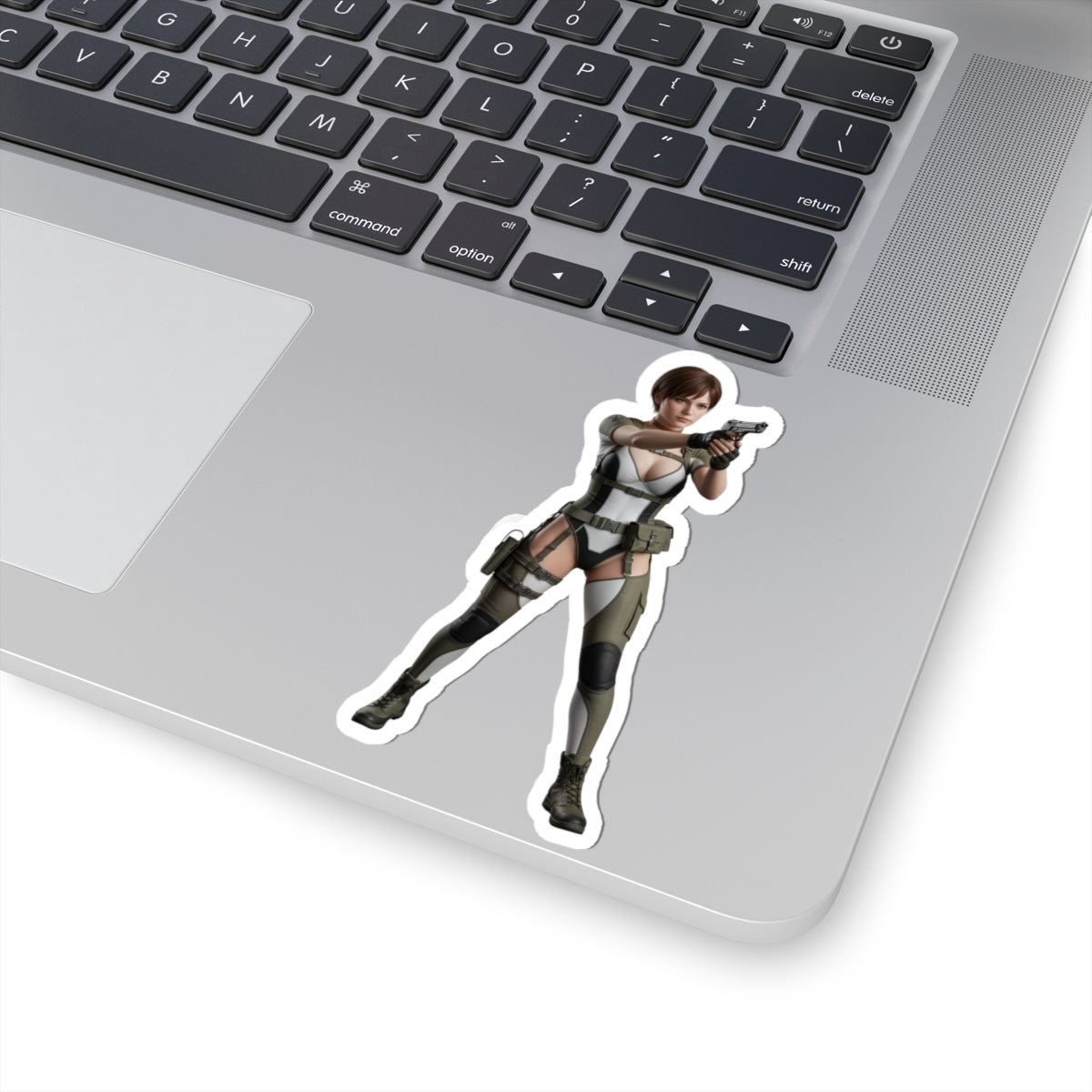 Rebecca Chambers Sticker – Survival Game Vinyl Sticker for Laptops & Indoor Decor on laptop showing glossy die-cut vinyl decal of character in combat pose