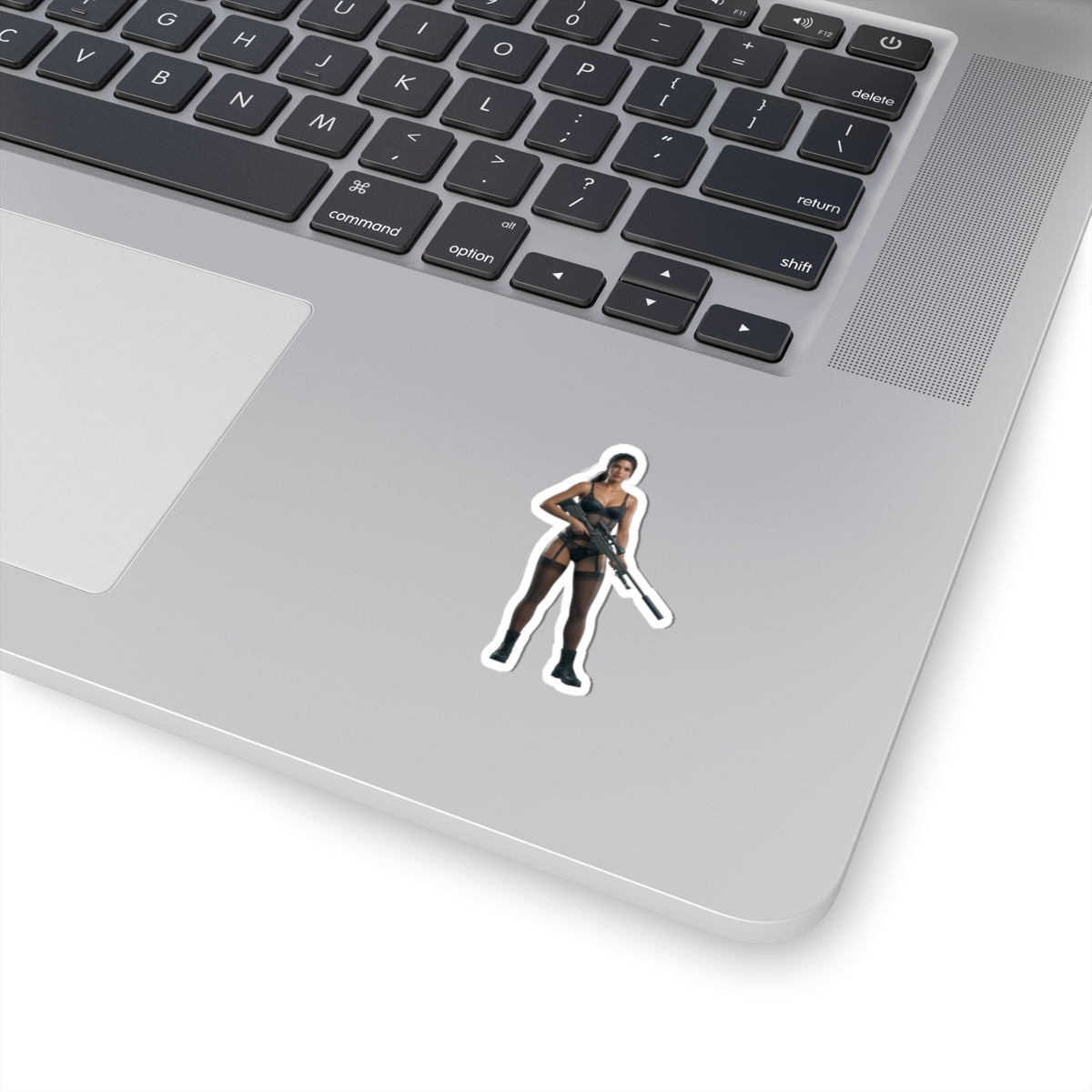 Quiet Metal Gear Sticker – Stealth Game Vinyl Sticker for Laptops & Indoor Decor on silver laptop showing glossy die-cut character sticker near trackpad