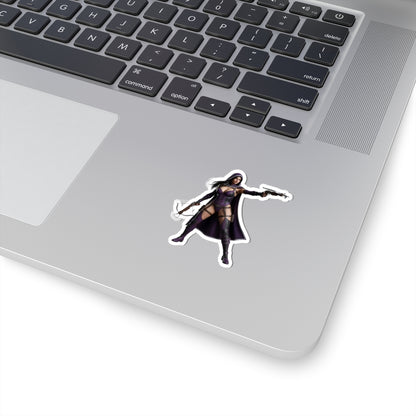 Huntress Sticker – Comic Heroine Vinyl Sticker for Laptops & Indoor Decor on silver laptop showing dark comic heroine with cape and guns
