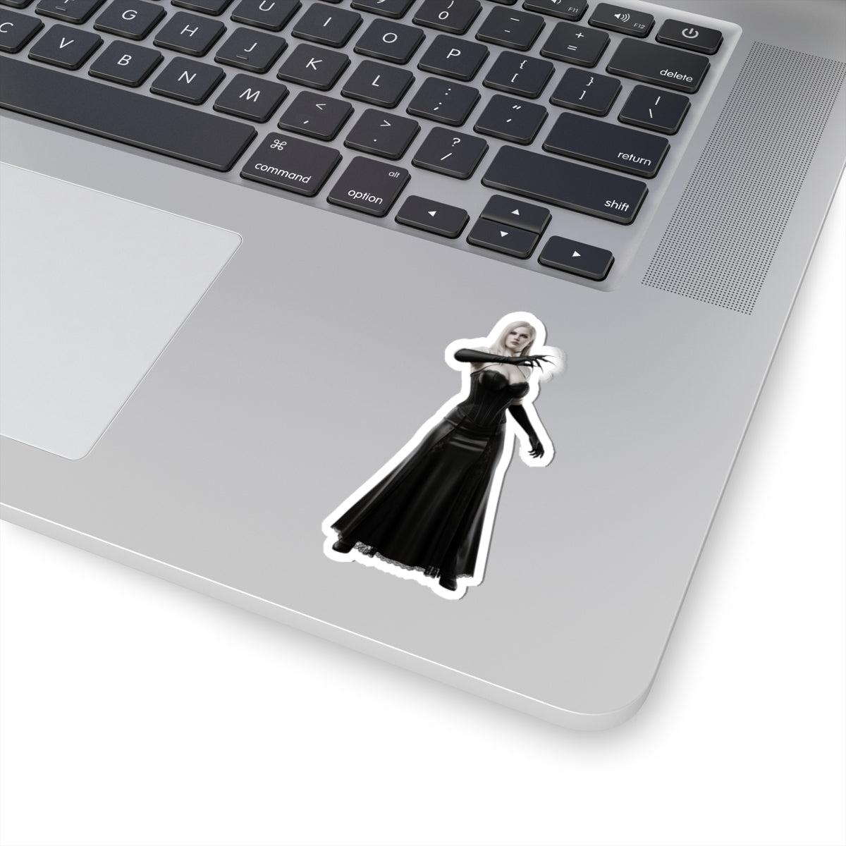 Lady Dimitrescu Sticker – Gothic Game Character Vinyl Sticker for Laptops & Decor on silver laptop showing glossy die-cut vinyl sticker with elegant gothic character